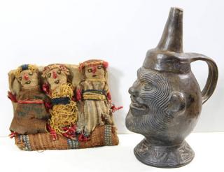 Appraisal: Chimu Peru stirrup vessel head depciting the face of a