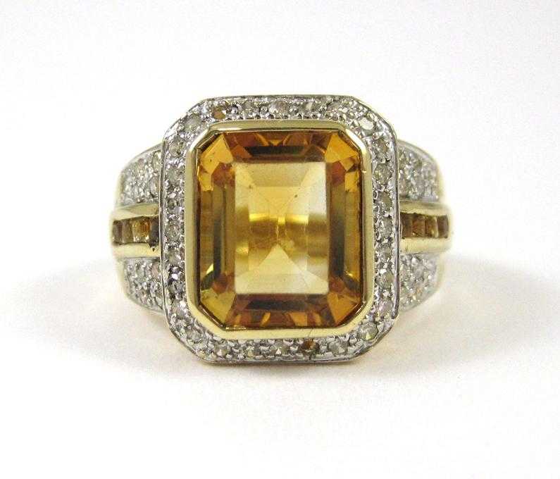 Appraisal: CITRINE DIAMOND AND TEN KARAT GOLD RING The yellow and