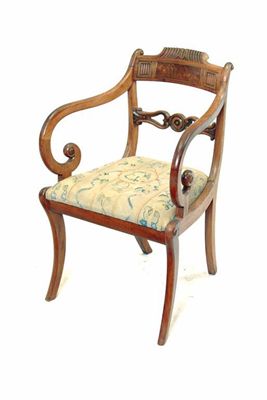 Appraisal: A late Regency mahogany and brass inlaid open armchair with