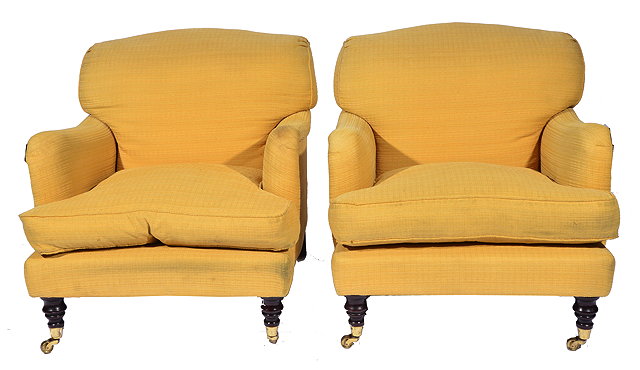 Appraisal: A PAIR OF HOWARD STYLE ARMCHAIRS with yellow upholstery and