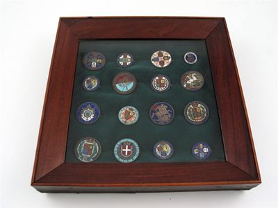 Appraisal: A framed collection of enamelled coins all brooch mounted and