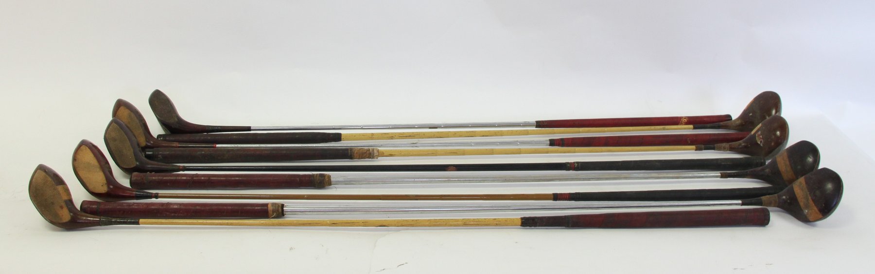 Appraisal: A collection of nine steel shafted woods including W Nolan