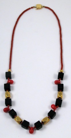 Appraisal: BLOOD CORAL AND BLACK ONYX NECKLACE in length and strung