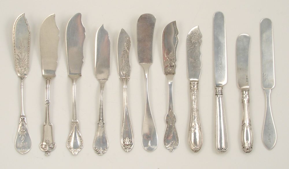 Appraisal: ELEVEN STERLING AND COIN SILVER MASTER BUTTER KNIVES th CenturyBy