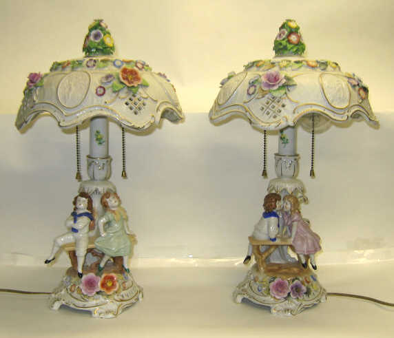 Appraisal: PAIR OF GERMAN PORCELAIN FIGURAL LAMPS Dresden style with couple