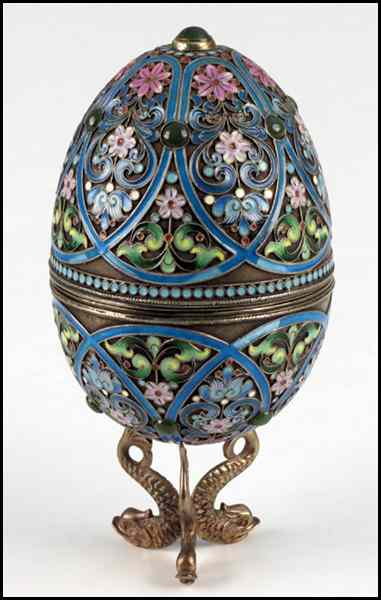 Appraisal: RUSSIAN CHAMPLEVE ENAMEL AND GILT SILVER EGG Interior bears stamped