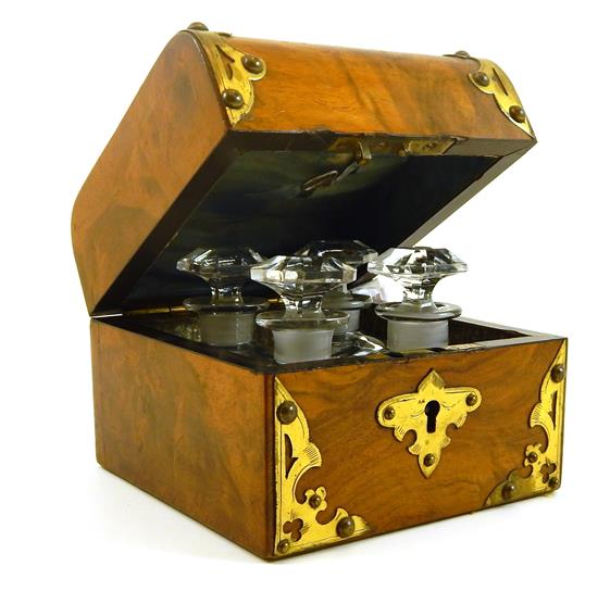 Appraisal: Turn-of-the-century miniature cellaret oak case decorated with pierced brass spandrels