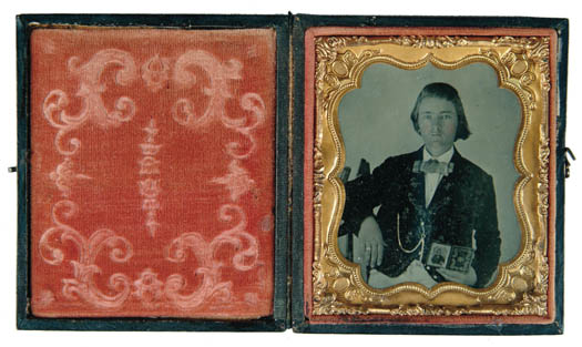 Appraisal: RARE PLATE AMBROTYPE OF A BOY HOLDING A DAGUERREOTYPE The