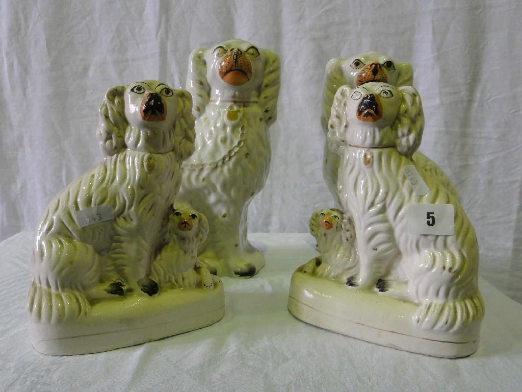 Appraisal: A pair of th century Staffordshire spaniels and pups with