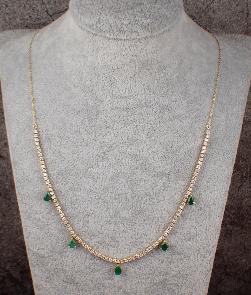 Appraisal: DIAMOND EMERALD AND FOURTEEN KARAT GOLD NECKLACE The k yellow