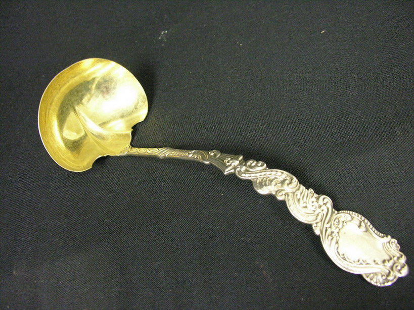 Appraisal: GORHAM STERLING PUNCHBOWL LADLE Monogrammed F on back Size troy