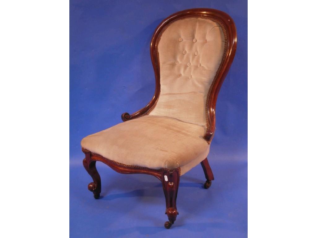 Appraisal: A Victorian mahogany spoon back nursing chair with buttoned draylon