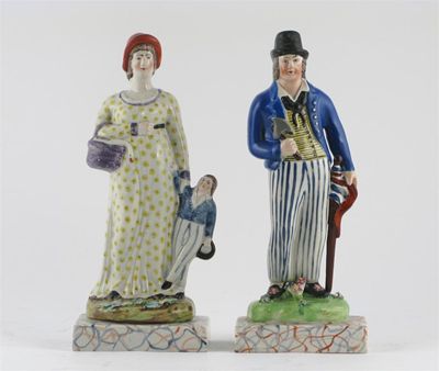 Appraisal: A matched pair of pearlware figures of a sailor and