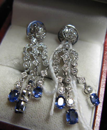 Appraisal: PAIR OF SAPPHIRE DIAMOND AND EIGHTEEN KARAT WHITE GOLD DANGLE