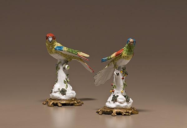 Appraisal: MEISSEN-STYLE PORCELAIN PARROTS ON ORMOLU BASES Continental th century A