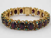 Appraisal: A yellow metal tests carat gold bracelet set with garnets