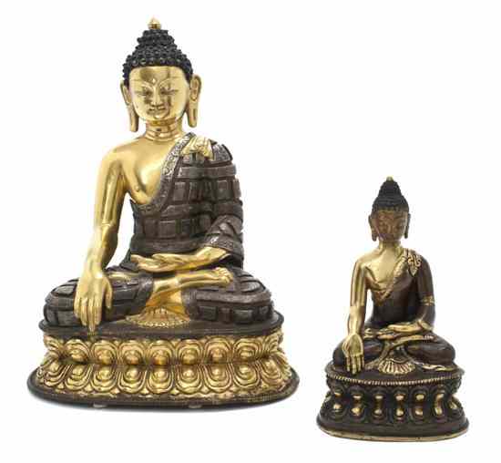 Appraisal: A Pair of Tibetan Bronze Seated Buddhas each having knot