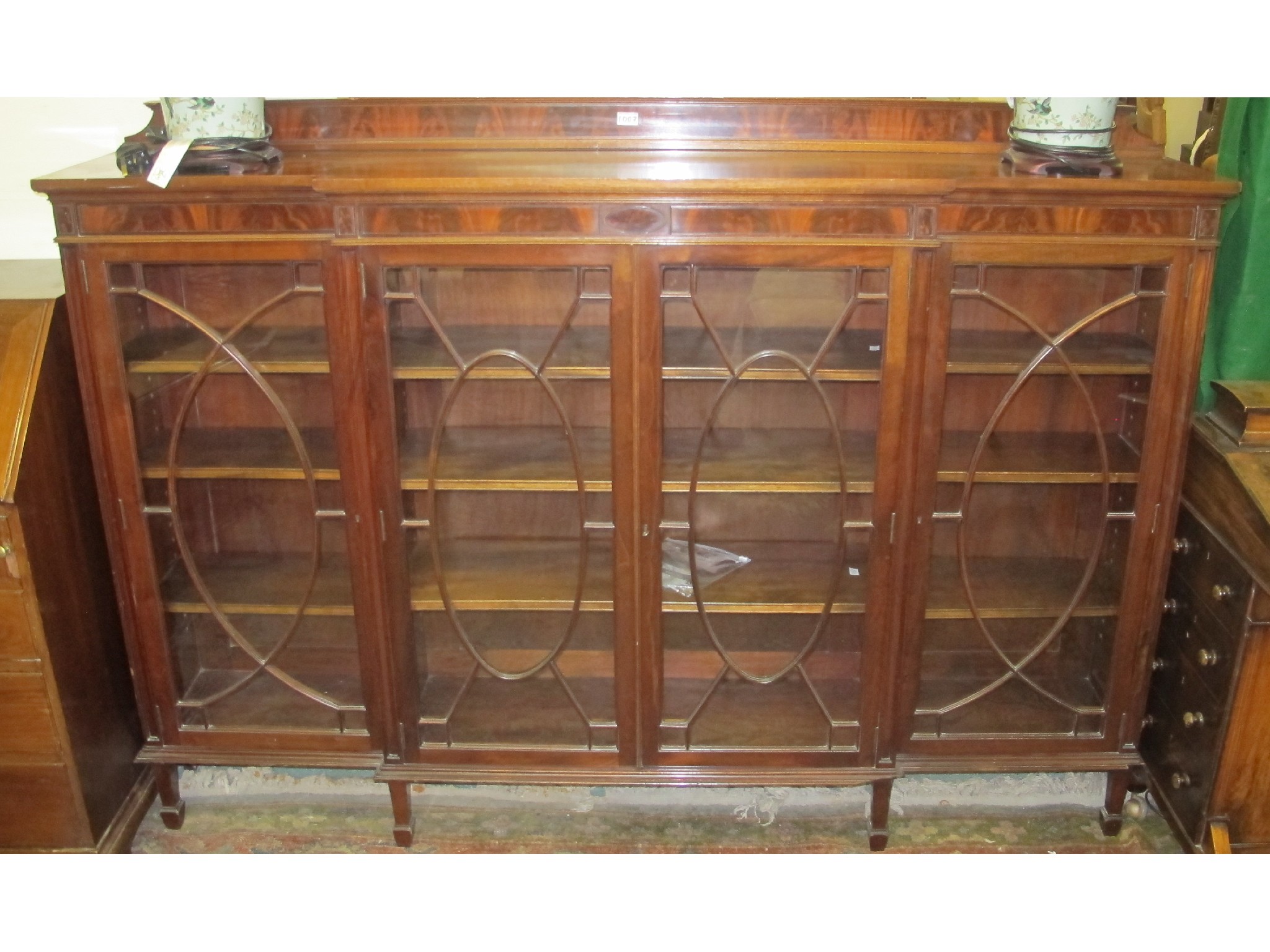 Appraisal: A mahogany break front four door bookcase