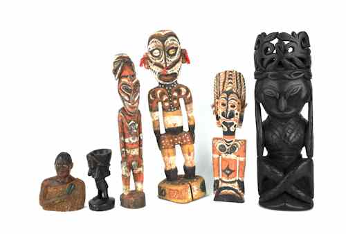 Appraisal: Five South Pacific carved figures together with a New Zealand