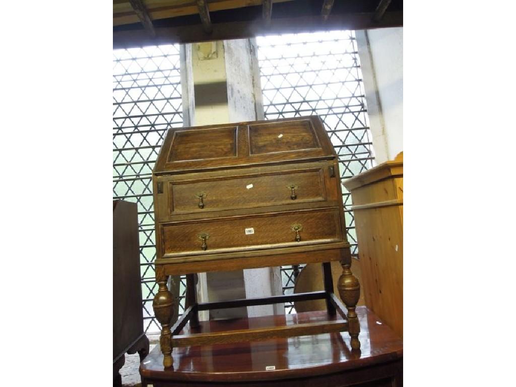 Appraisal: An Edwardian 's oak bureau the twin moulded panelled fall