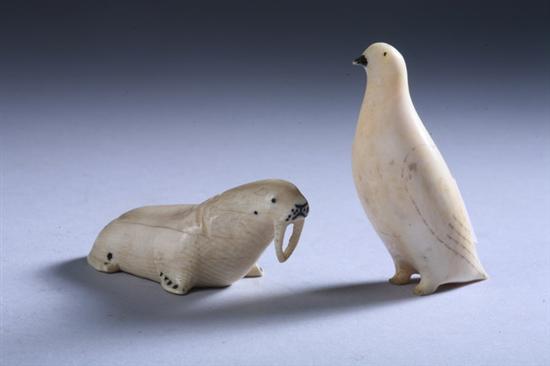 Appraisal: TWO INUIT CARVED IVORY FIGURES OF A WALRUS AND PENGUIN