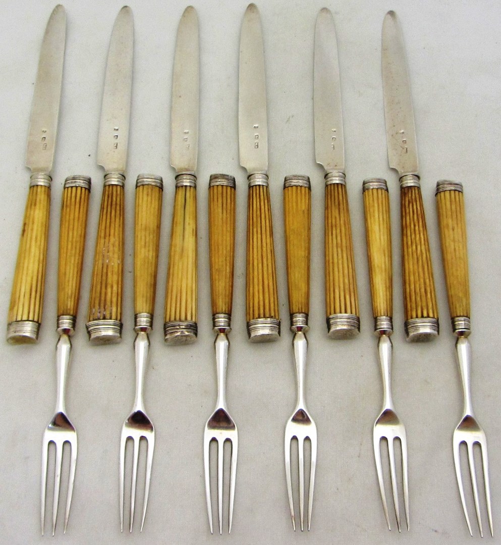 Appraisal: Six pairs of dessert knives and forks with fluted ivory