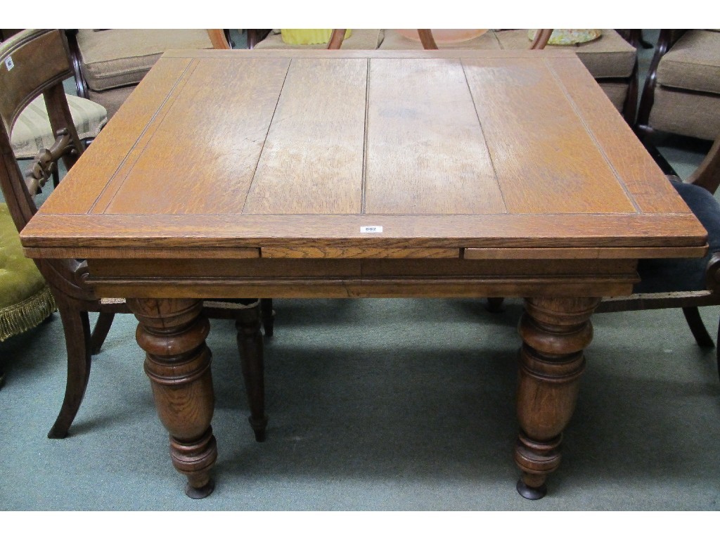 Appraisal: Oak pull out dining table raised on Victorian baluster supports