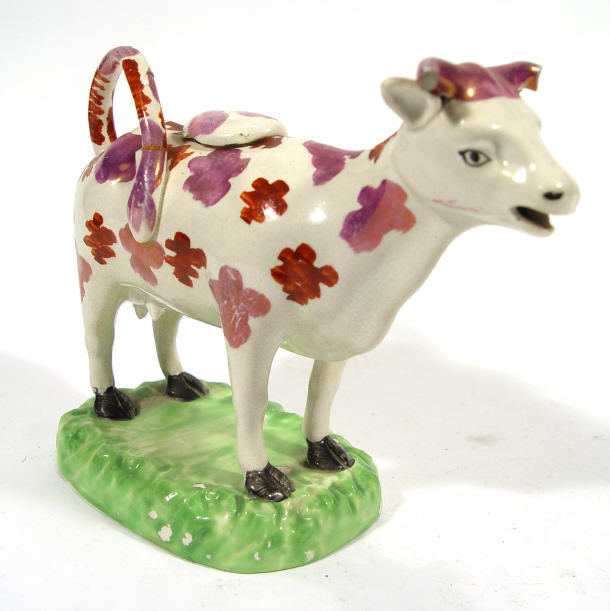 Appraisal: Victorian pottery cow creamer decorated with pink lustre spots cm