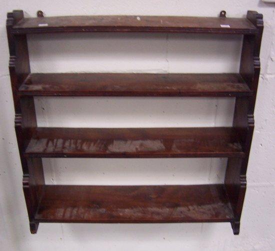 Appraisal: A mahogany hanging waterfall bookcase cm wide