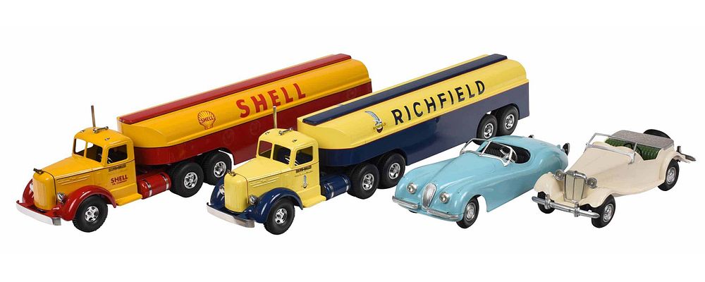 Appraisal: Four Toy Cars and Trucks pressed steel s Jaguar powder