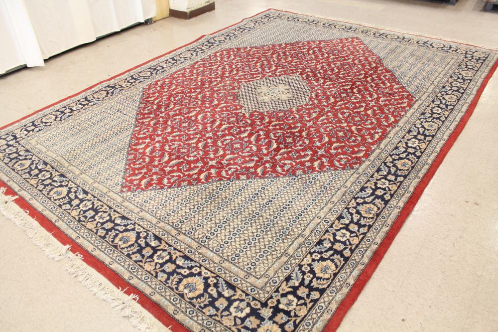 Appraisal: HAND KNOTTED ORIENTAL CARPET Indo-Persian central medallion and surrounding floral