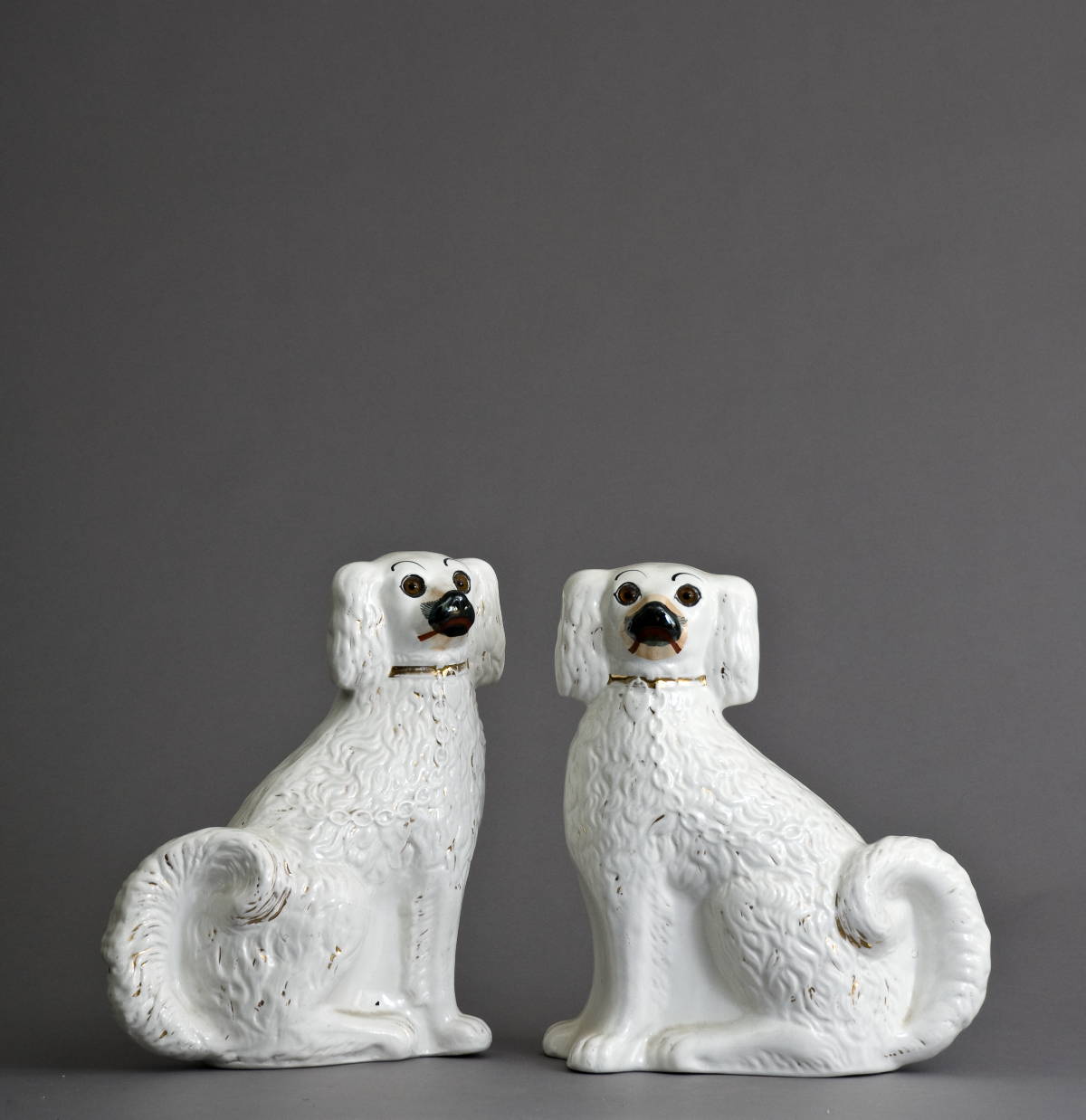 Appraisal: PAIR OF STAFFORDSHIRE DOGS WITH GLASS EYES Height inches