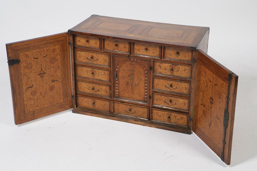 Appraisal: A NORTH EUROPEAN MARQUETRY AND SATINWOOD TABLE CABINET with all