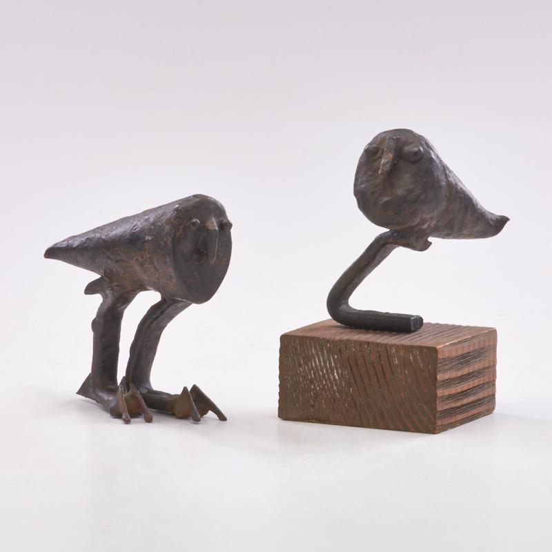 Appraisal: STYLIZED HARPY EAGLES Pair of bronzes one on wooden stand