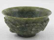 Appraisal: A Chinese hardstone bowl carved in relief with dragons cm