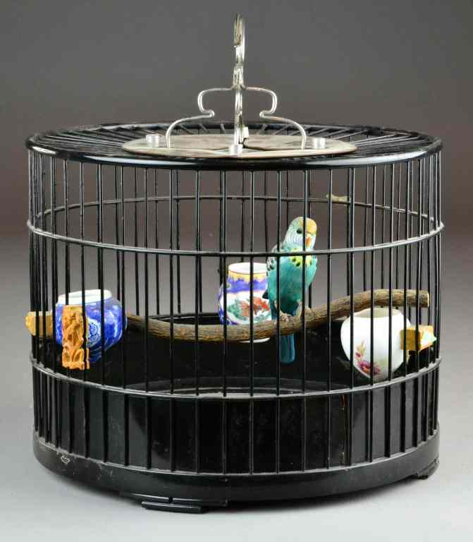 Appraisal: Chinese Lacquer Birdcage w Porcelain FeedersBlack lacquered drum-shaped wooden cage