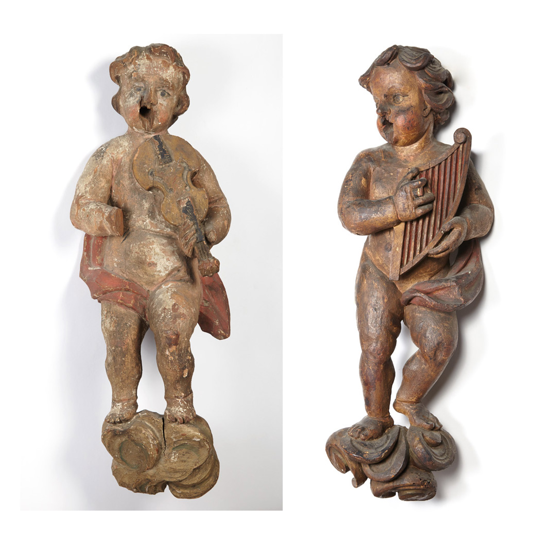 Appraisal: Two Continental Carved and Polychrome Decorated Figures of Putti Possibly