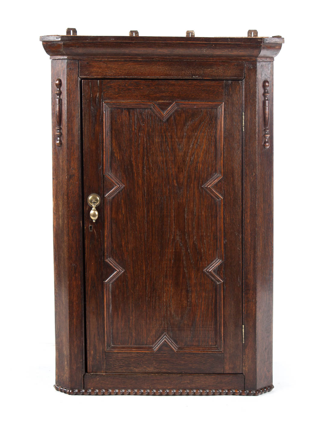 Appraisal: Elizabethan Revival oak hanging corner cupboard th century flat molded