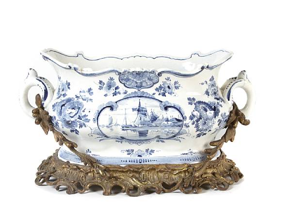 Appraisal: A Delft earthenware and gilt metal mounted centerpiece bowl restorations