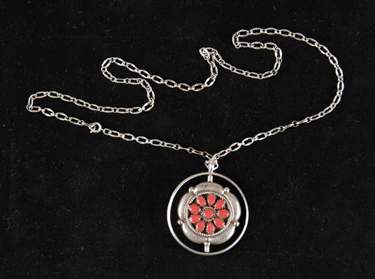 Appraisal: SILVER TURQUOISE AND CORAL PENDANT The circular pendant with inner