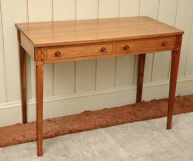 Appraisal: A CONTEMPORARY WALNUT SIDE TABLE made by Bruce Burman for