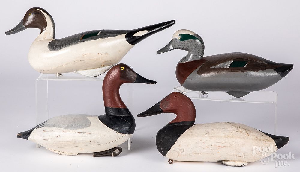 Appraisal: Four carved and painted duck decoys Four carved and painted