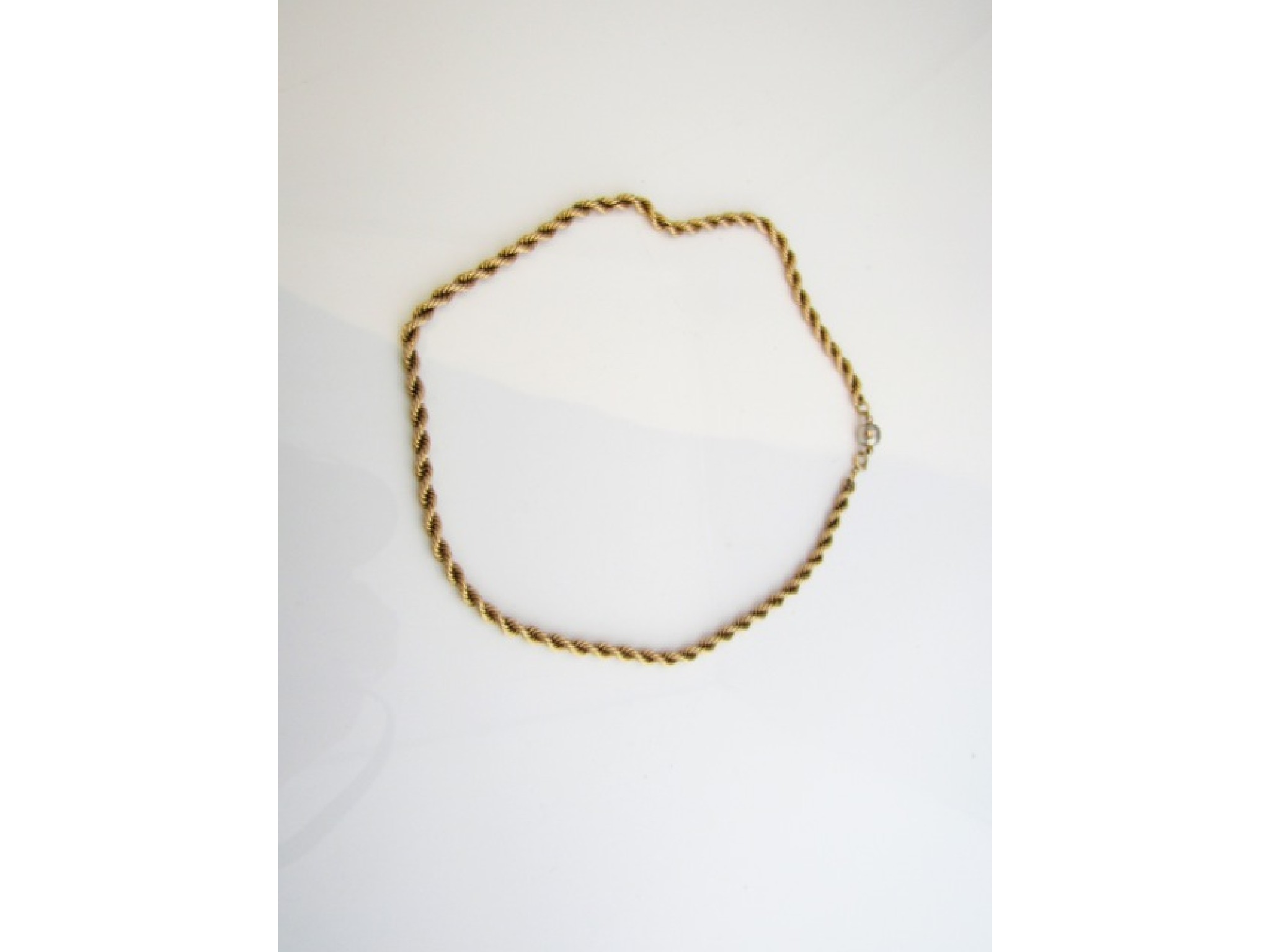 Appraisal: A ct gold rope-twist necklace with later metal ball clasp