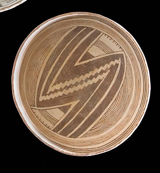 Appraisal: A Mimbres black-on-white bowl With central zigzag motif flanked by