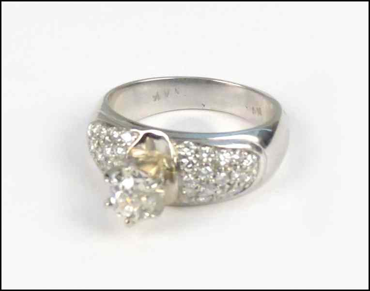 Appraisal: DIAMOND AND KARAT WHITE GOLD RING Central oval diamond is