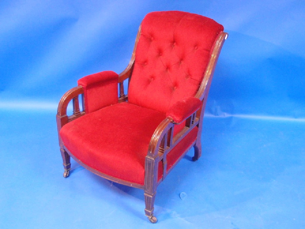 Appraisal: Late Victorian walnut-framed armchair with button-upholstered back and semi-padded arms