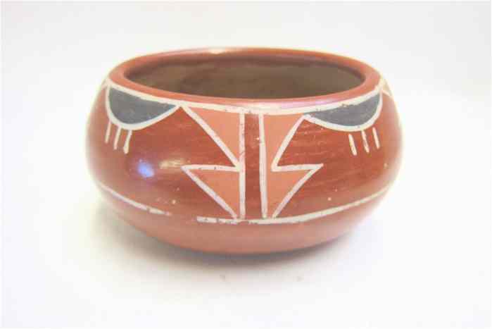 Appraisal: SANTA CLARA PUEBLO CLAY OVAL BOWL having red slip and