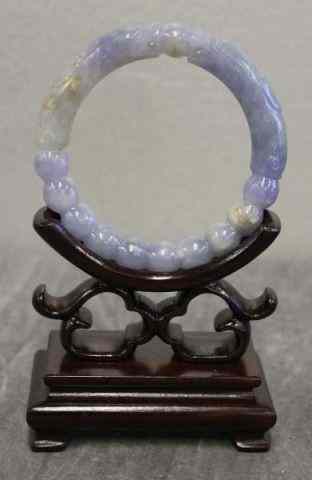 Appraisal: Lavender Jade Bracelet with Dragons On a modern hardwood stand