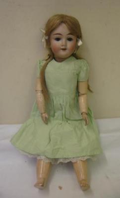 Appraisal: A Max Handwerke bisque head doll with blue sleeping eyes