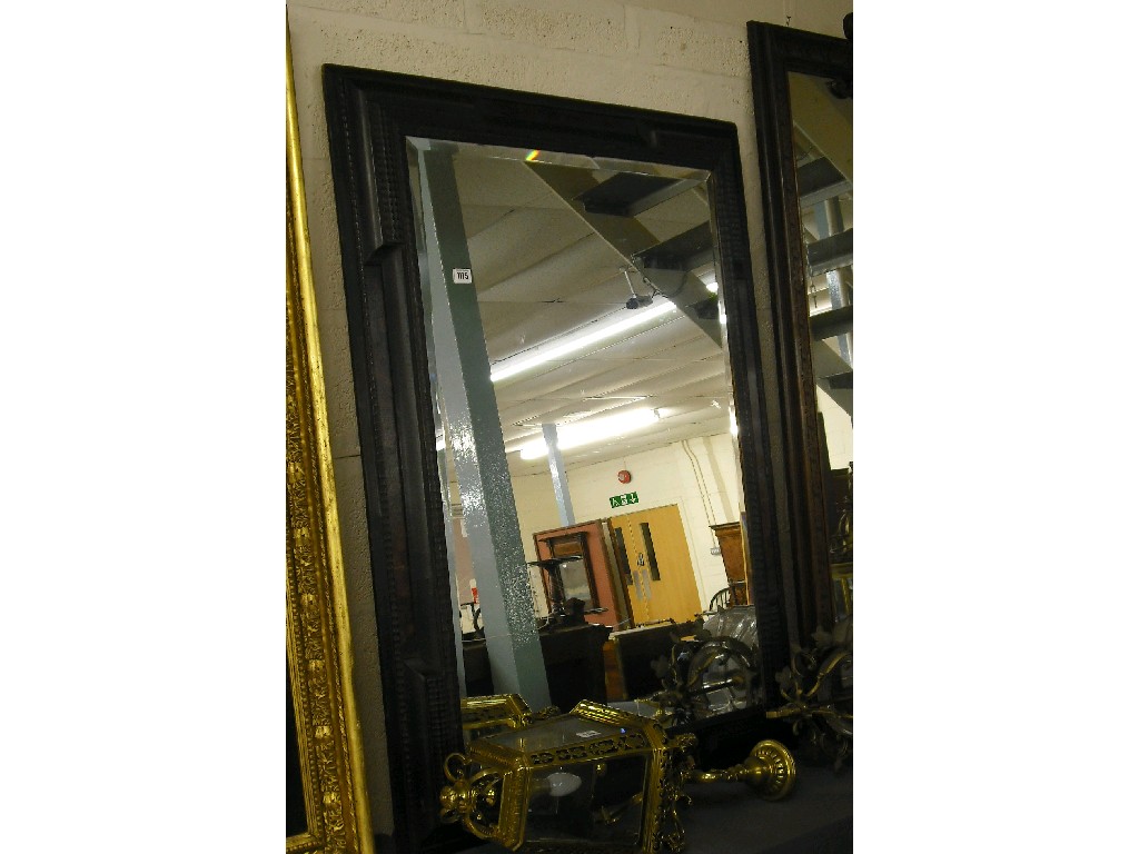 Appraisal: th century Italian ebonised bevel edged wall mirror with painted